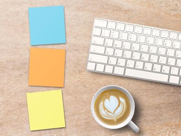 Vue de dessus avec clavier notemini collant coloré et café sur table en bois