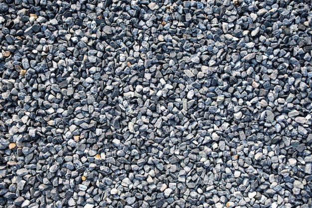 Photo vue de dessus du fond de texture de gravier de construction bleue petite pierre de granit