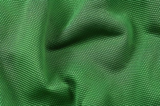 Vue de dessus du fond de texture de tissu de maillot de football vert