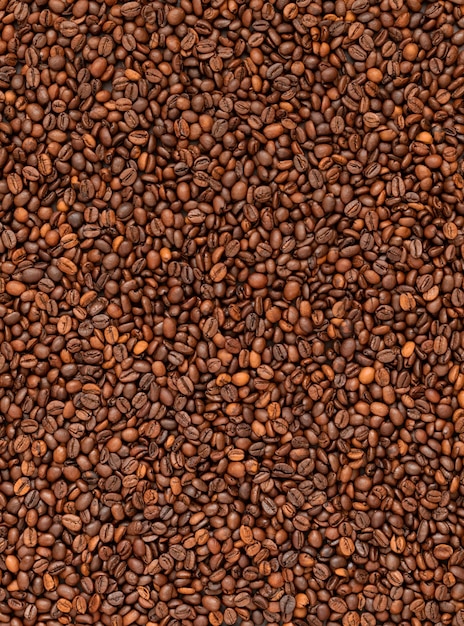 Vue de dessus de fond de grains de café torréfiés frais