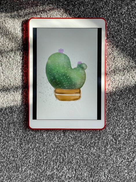 Vue de dessus de l'illustration de cactus aquarelle sur tablette numérique