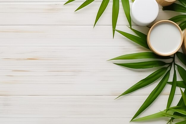 Vue de dessus d'une table en bois blanche avec des produits cosmétiques et un espace de copie de feuilles de bambou Ai généré