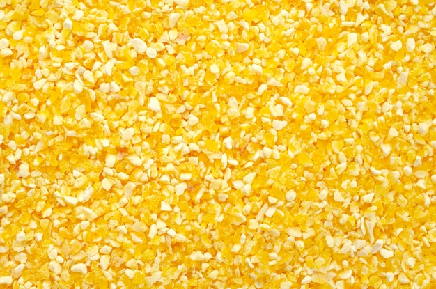 Vue de dessus de la texture de la semoule de maïs jaune de polenta Fond de polenta semoule de maïs jaune