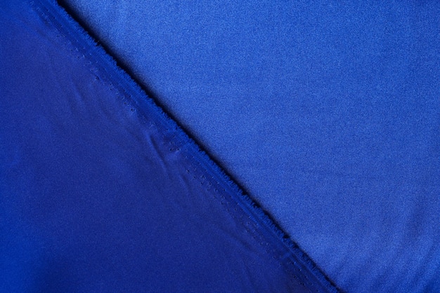 Vue de dessus de la texture de tissu bleu pour l'arrière-plan et la conception d'œuvres d'art textile marine avec