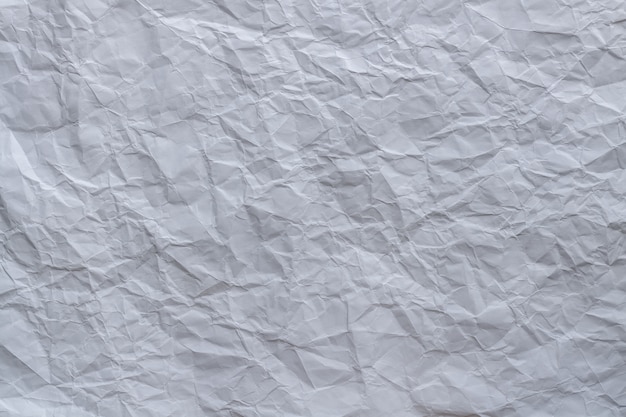 Vue de dessus texturée de fond de papier blanc froissé