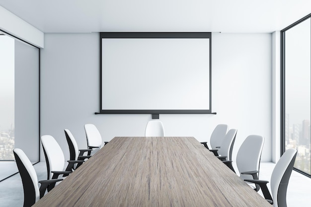 Vue de face sur une affiche blanche vierge dans un cadre noir sur un mur clair dans une salle de réunion moderne avec une table en bois vide entourée de chaises noires et blanches et vue sur la ville depuis une grande fenêtre Rendu 3D maquette