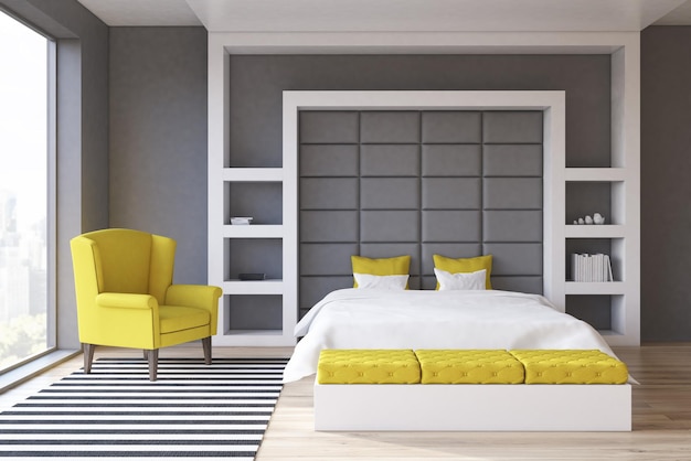Vue de face d'une chambre aux murs gris avec une fenêtre panoramique et un fauteuil jaune à côté d'un lit double. rendu 3d.