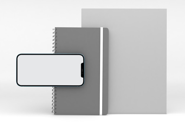 Vue de face du livre et du téléphone sur fond blanc