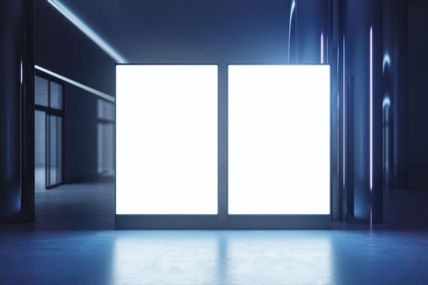 Vue de face sur des écrans rétro-éclairés blancs vierges avec un espace pour votre logo ou texte sur un sol brillant avec réflexion sur fond de salle vide sombre Maquette de rendu 3D