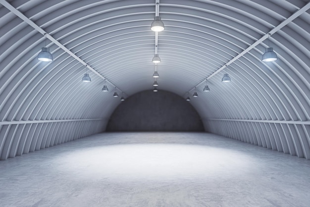 Vue de face intérieur du hangar gris avec projecteur et fond de voiture au sol en béton et concept de scène vide Maquette de rendu 3D