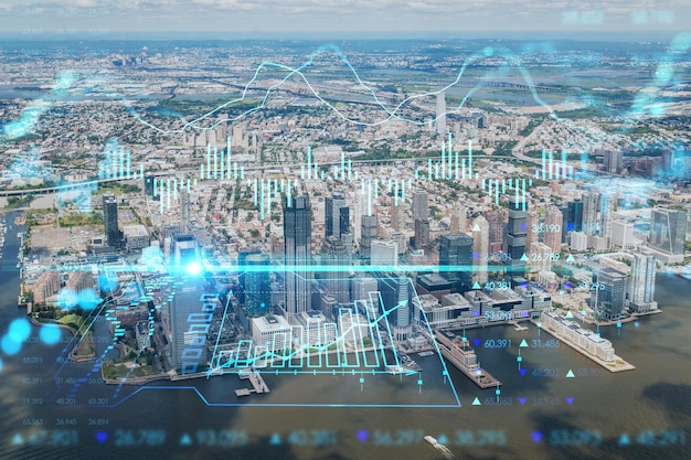 Vue panoramique aérienne sur la ville en hélicoptère des gratte-ciel du centre-ville financier de New Jersey City Hologramme graphique Forex Le concept de courtage commercial sur Internet et d'analyse fondamentale