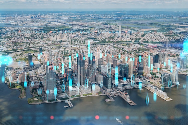 Vue panoramique aérienne sur la ville en hélicoptère des gratte-ciel du centre-ville financier de New Jersey City Hologramme graphique Forex Le concept de courtage commercial sur Internet et d'analyse fondamentale