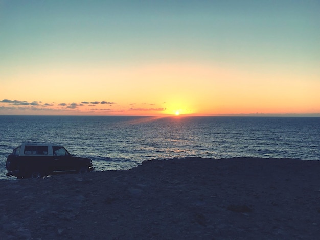 Photo vue panoramique de la mer contre le ciel au coucher du soleil