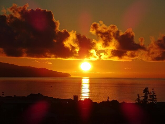 Photo vue panoramique de la mer contre le ciel au coucher du soleil