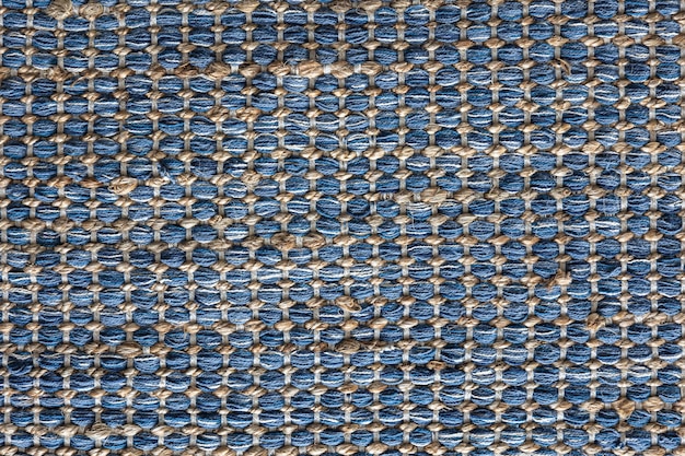 Vue plate du tapis de jute tressé de couleur bleue concept de texture de fond