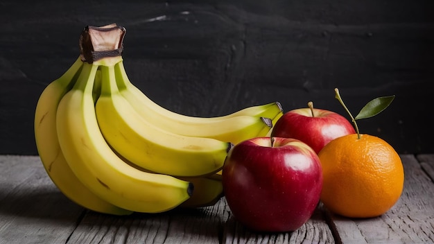 Vue de près de la source de nutrition biologique un paquet de bananes fraîches et des pommes rouges une orange avec ste