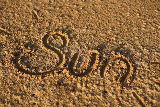 Photo vue rapprochée du texte sur le sable