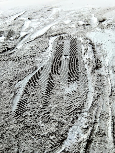 Photo vue rapprochée d'une empreinte de pied sur une plage de sable