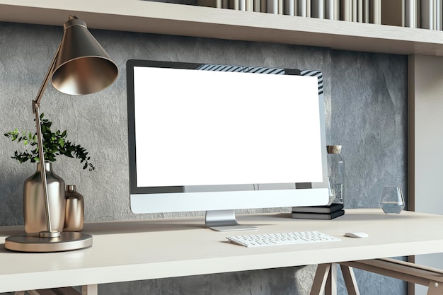 Vue rapprochée de l'espace de travail du designer contemporain avec un écran d'ordinateur 3D vide