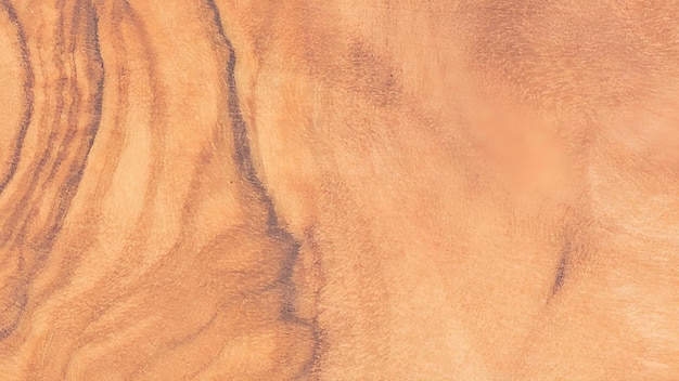 Vue rapprochée d'une surface en bois présentant des motifs de grain et des nœuds complexes