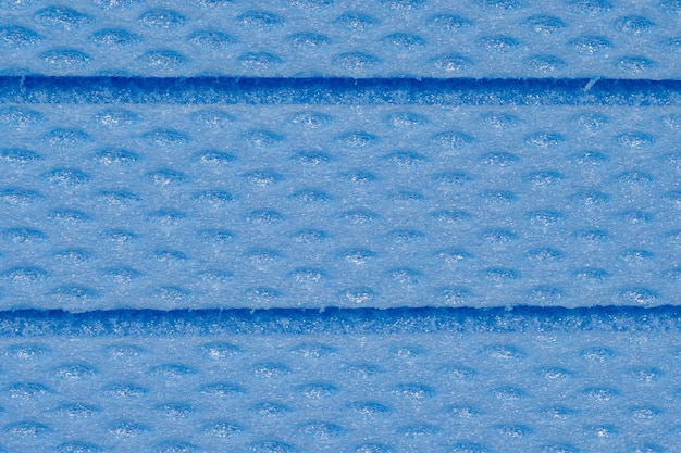 Vue rapprochée de la texture du panneau en mousse xps bleu