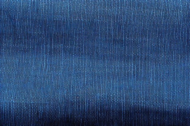 Photo vue rapprochée de la texture du tissu bleu pour l'arrière-plan