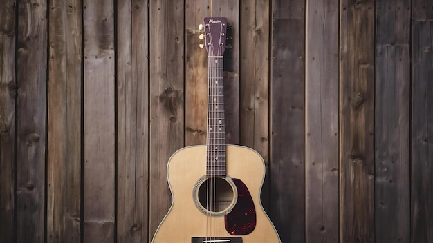 Photo vue supérieure de la guitare acoustique avec fond en bois