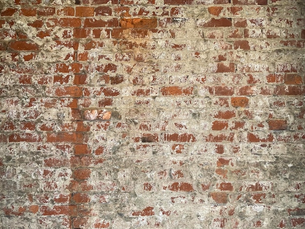 Weathered plâtré vieille texture de mur de grunge de brique rouge pour le fond avec espace de copie