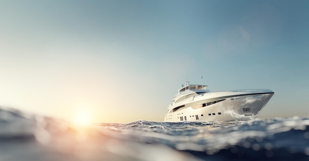 Yacht à moteur de luxe sur l'océan au coucher du soleil