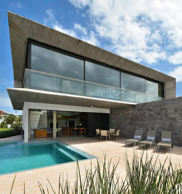 a house with a pool and a pool with a sky background