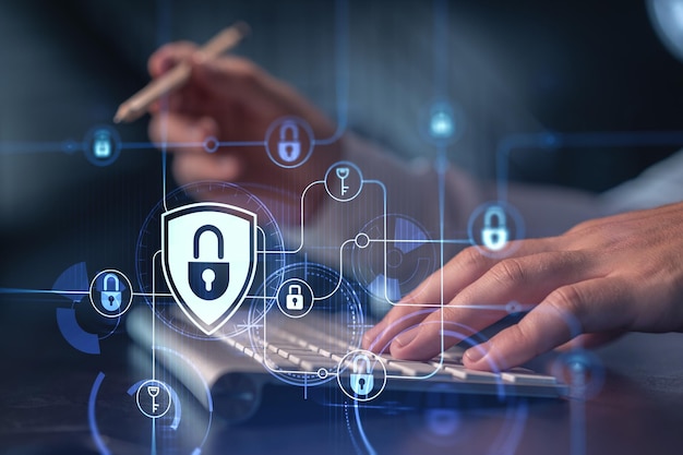 A programmer is typing a code on computer to protect a cyber security from hacker attacks and save clients confidential data Padlock Hologram icons over the typing hands Formal wear