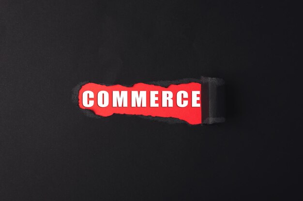 a red and white word that says commerce is written on a black background