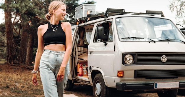a woman stands in front of a van that says quot fire extinguisher quot