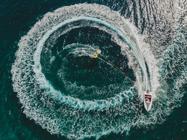 Aerial view of boat sailing in sea