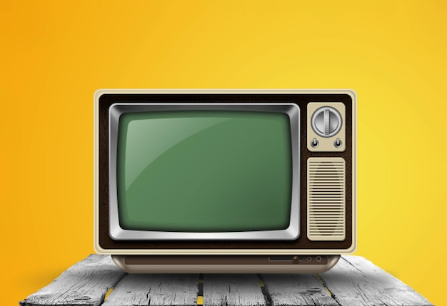 An old vintage television set from the 1970s stands on a wooden desk