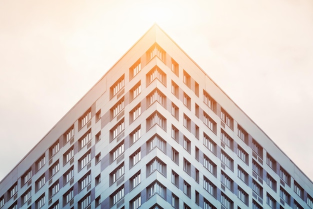 Angle of the skyscraper on the sky background sunny