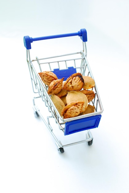Apricot and peach kernels in a shopping cart image of a