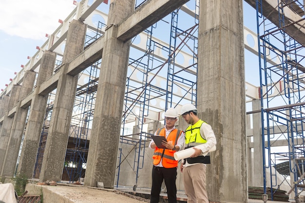 Architects engineer are checking the progress of the building project and checking the accuracy of the building structure