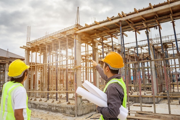 Asian business man construction engineer worker at house building site