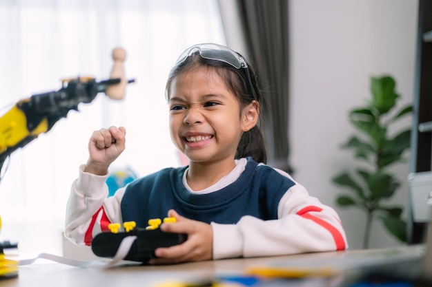 asian girls were learning robot programming and getting lessons control on robot arms laboratory mathematics engineering science technology computer code coding stem education