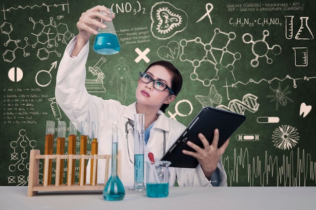 Attractive doctor examine chemical at laboratory