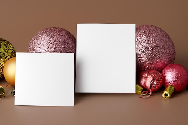 Beautiful mockup of a white card with Christmas ornaments on the side of the card