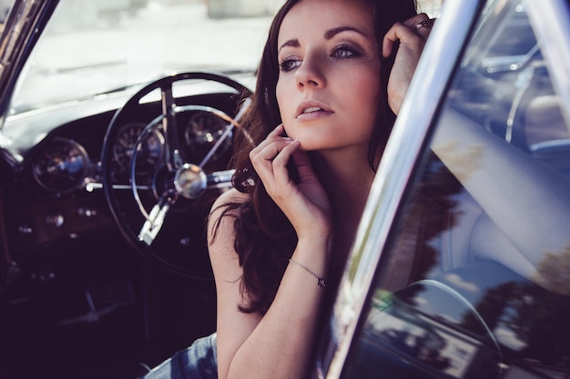 beautiful woman sitting in car