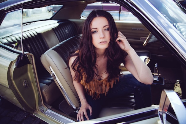 beautiful woman sitting in car