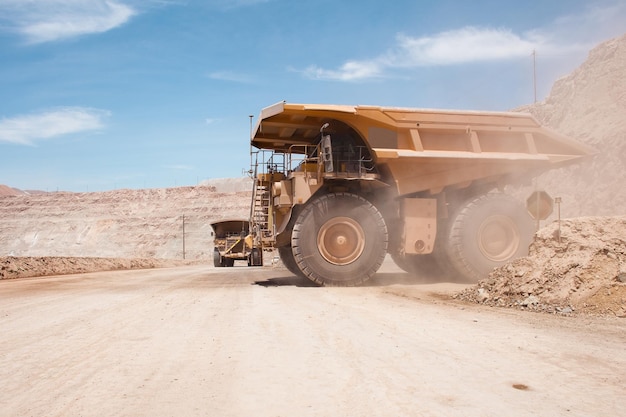 Big dump trucks at an open-pit copper mine in peru