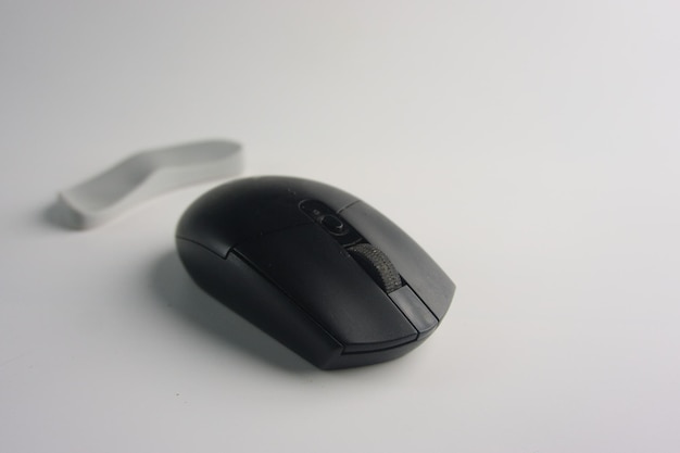 Black Modern Wireless Computer Mouse Placed On White Background Surface
