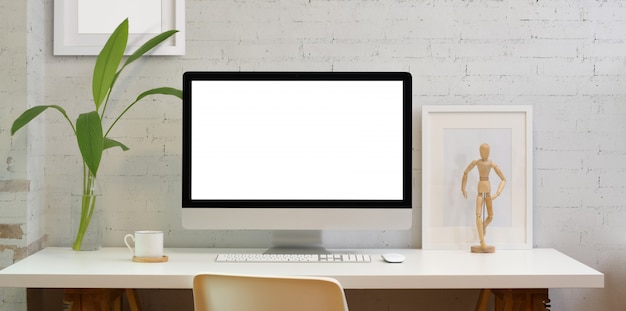 Blank screen desktop computer in minimal style office 