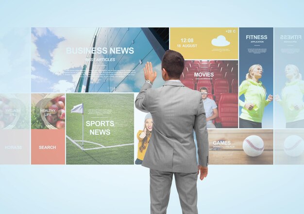 business, people, technology, internet and mass media concept - businessman touching web pages virtual projection from back