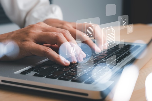 business woman hand using laptop computer with document management icon document management data system business internet technology concept