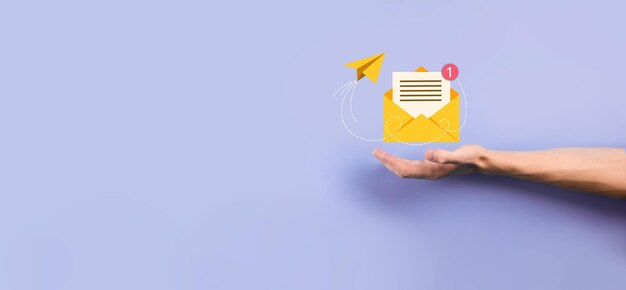 Businessman hand holding letter iconemail iconsContact us by newsletter email and protect your personal information from spam mailCustomer service call center contact usEmail marketing newsletter